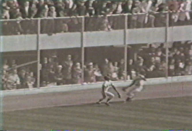 Fans watch through the fence during the 1965 World Series (Source: World Series Video)